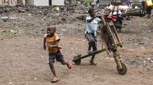 epa11874947 Children play with a traditional wooden two-wheeled handmade car called 'Chikudu' at a compound, as schools remain closed down due to conflicts on the outskirts of Goma, Democratic Republic of the Congo, 04 February 2025. Over 900 people were killed and around 2,800 injured in the last two weeks in the eastern city of Goma of the DRC amid fighting between the M23 (March 23 Movement) rebel group and the government forces, the World Health Organization said on 03 February. The M23 (March 23 Movement) took control of Goma city, the capital of the North Kivu Province, days after claiming to have captured most of it after launching a large-scale offensive in the east of the DR Congo, which the DR Congo and the UN accuse Rwanda of backing.  EPA/STRINGER