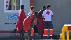 epa11685620 Rescued migrants are assisted by officials and Red Cross team in El Pinar, on the island of El Hierro, Spain, 26 October 2024. The 175 migrants rescued by the Maritime Rescue vessel, Salvamar Adhara, in waters near El Hierro, are transferred to the port of La Restinga, to be treated by the emergency teams.  EPA/GELMERT FINOL