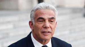epa10053638 Israeli Prime Minister Yair Lapid speaks at a press conference with French President Emmanuel Macron (not pictured) at the Elysee Palace in Paris, France, 05 July 2022. The new Israeli PM is in France for his first official international visit.  EPA/Mohammed Badra