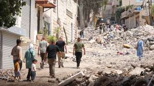 epa11589228 Palestinians inspect the damage after a ten-day Israeli military operation in Jenin, West Bank, 06 September 2024. At least 39 Palestinians, including eight children and two elderly people, have been killed and around 150 others injured since the start of Israeli military operations in the West Bank on 28 August 2024, according to the Palestinian Ministry of Health. The Israeli military stated on 06 September, that Israeli forces have conducted &#039;counterterrorism activity&#039; in the area of Jenin over the past week and a half, adding that 14 &#039;terrorists&#039; have been killed, over 30 suspects detained and four aerial strikes were conducted in the area.  EPA/ALAA BADARNEH