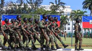 epa12972389 Members of the Haitian Armed Forces (FAd'H) participate in a ceremony marking the 223rd anniversary of Flag Day at the National Palace gardens in Port-au-Prince, Haiti, 18 May 2026.  EPA/Mentor David Lorens