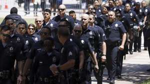 epa11313506 Police officers gathered near the encampment of pro-Palestinian protesters on the campus of University of California Los Angeles (UCLA) in Los Angeles, California, USA, 01 May 2024. Nationwide protests have sprung up across the country on school campuses, many calling for institutions to divest investments in Israel and in support of a ceasefire in the Gaza conflict.  EPA/CAROLINE BREHMAN
