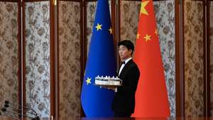 epa12237251 A staff member prepares for the arrival of attendees of the Sixth China-EU High Level Environment and Climate Dialogue (HECD) at the Diaoyutai State Guest House in Beijing, China, 14 July 2025.  EPA/WANG ZHAO / POOL
