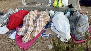 epa13198122 Migrants sleep on El Trampolin beach in Ceuta, an autonomous city of Spain on the North African coast, on 29 August 2026, a day after thousands of people protested against the situation in the city after the mass crossing of migrants on 30 July 2026.  EPA/Reduan