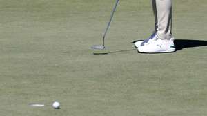 epa12878220 Danny Willett of England putts as the ball circles the drain and does not fall into the drain on hole 2 during Round 1 of the 2026 Masters tournament in August, Georgia, USA, 09 April 2026.  EPA/ERIK S. LESSER