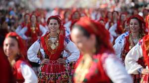 Portuguese women wearing traditional gold attached costumes takes part in the annual parade of Our Lady Of Agony (Agonia) Pilgrimage in Viana do Castelo, Portugal, 19 August 2026. The pilgrimage dates back to the 18th century and is celebrated in August. The gold adorning the costumes has an overall estimated value of several million euros. ESTELA SILVA/LUSA