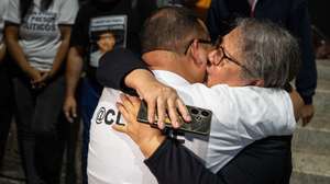 epa12770616 Lewis Jose Mendoza (L), the political leader of Vente Venezuela, embraces his mother upon release from the Bolivarian National Police headquarters in La Yaguara, Caracas, Venezuela, 22 February 2026.  EPA/Ronald Pena R