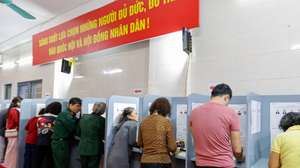 epa12820468 People fill out ballot papers at a polling station in Hanoi, Vietnam 15 March 2026. Vietnam holds general elections for the 16th National Assembly and People's Councils at all levels for the 2026–2031 term on 15 March.  EPA/LUONG THAI LINH