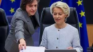 epaselect epa11597950 European Commission President Ursula Von der Leyen watches her name card being put on the table before the 2500th meeting of the College of Commissioners in Brussels, Belgium, 11 September 2024. The first formal meeting of the European Commission took place in Brussels on 16 January 1958 which was by then the European Economic Community (ECC). It was chaired by Walter Hallstein, President of the Commission of the European Economic Community.  EPA/OLIVIER HOSLET