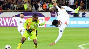 epa11976521 Mohammad Mohebi of Iran (R) in action against goalkeeper Khalid Eisa of UAE during the FIFA World Cup 2026 qualification soccer match between Iran and the United Arab Emirates in Tehran, Iran, 20 March 2025.  EPA/ABEDIN TAHERKENAREH