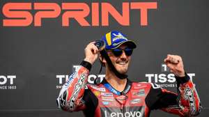 epa13051710 Italian MotoGP rider Francesco Bagnaia of Ducati Lenovo Team celebrates on podium after winning the Sprint race at the Motorcycling Grand Prix of the Czech Republic at Masaryk circuit in Brno, Czech Republic, 20 June 2026.  EPA/MARTIN DIVISEK