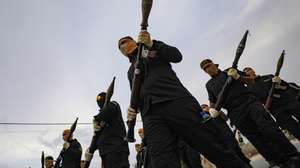 epa10900401 Fighters of the Al-Quds Brigades, the armed wing of the Palestinian Islamic Jihad (PIJ) movement, hold RPGs (rocket propelled grenade launchers) as they mark the 36th anniversary of the movement&#039;s foundation with a parade in the southern of Gaza Strip, 04 October 2023.  EPA/MOHAMMED SABER