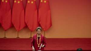 epa11631561 Former Brazilian President and current New Development  Bank (NDB) President Dilma Rousseff leaves the stage after her speech the Great Hall of People in Beijing, China, 29 September 2024. Dilma Rousseff was awarded the Friendship Medal during the ceremony that is held ahead of the 75th founding anniversary of the People's Republic of China, which will be on 01 October 2024.  EPA/ANDRES MARTINEZ CASARES