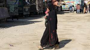 epa11001380 An Afghan refugee woman holds a baby as she walks at a registration center, after arriving from Pakistan, near the Afghanistan-Pakistan border in Spin Boldak district of Kandahar province, Afghanistan, 28 November 2023 (issued on 29 November 2023). About 1,7 million undocumented Afghans migrants who were in Pakistan have been affected by the 01 November deadline to leave the country, given to them by the Pakistani government, and as a result thousands of Afghans having to leave the country in a hurry. Pakistan&#039;s caretaker Prime Minister Anwaar-ul-Haq Kakar said his government&#039;s decision was in response to the Afghan administration&#039;s unwillingness to take action against the main Taliban group in the Asian country, the Tehreek-e-Taliban Pakistan (TTP).  EPA/STRINGER