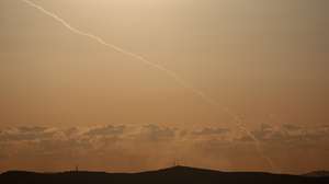 epa12807728 The trail of projectiles fired from southern Lebanon towards central Israel, as seen from the border in Upper Galilee, northern Israel, 09 March 2026. Israel's military stated it struck three launchers used to fire the rockets toward Israeli territory as part of an operation aimed at thwarting Hezbollah infrastructure.  EPA/ATEF SAFADI
