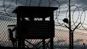 epa05488797 (FILE) A file picture dated 16 February 2006 shows a Joint Task Force member (L, silhouetted) climbing to his guard tower post surrounded by triple rows of razor barbed wire that perimeter the security of Camp Delta, Guantanamo Naval Sation, Cuba. According to media reports on 16 August 2016, the US has sent 15 Guantanamo Bay (GTMO) inmates, 12 Yemenis and three Afghanis, to the United Arab Emirates (UAE). The transfer, the largest under US president Barack Obama's administration, has brought the total number of prisoners in the US military prison down to 61, media added quoting the Pentagon.  EPA/JOHN RILEY