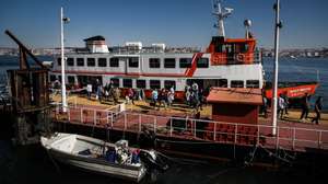 People disembark from a ferryboat 'cacilheiro' coming from Lisbon at Cacilhas station, Almada, Portugal, 20 May 2020. Public transportation has been strengthened with the entry of the second phase of deconfinement due to the covid-19 pandemic, despite this, careers are still short, which contrasts with the large use of river transport by Transtejo/Soflusa. MARIO CRUZ/LUSA
