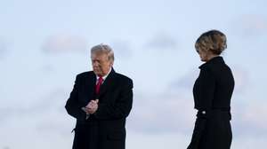 epa08953514 U.S. President Donald Trump, left, and U.S. First Lady Melania Trump prepare to depart a farewell ceremony at Joint Base Andrews, Maryland, USA, 20 January 2021. US President Donald J. Trump is not attending the Inaugration ceremony of President-elect Joe Biden. Biden won the 03 November 2020 election to become the 46th President of the United States of America.  EPA/Stefani Reynolds / POOL