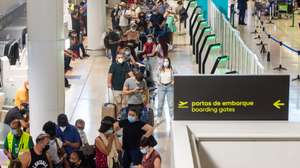 Passengers wait hours in long lines for their flight due to a strike of the handling company, Groundforce, which is causing major disruption in the Lisbon Airport, causing the cancelation of dozens of flights, in Lisbon, Portugal, 17 July 2021. Groundforce workers are protesting against colective dismissal of workers and low salaries. JOSE SENA GOULAO/LUSA