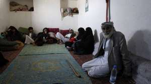 epa08495615 Yemeni displaced Mohammed Ahmed, 77, (R) and his relatives sit in a rental house in Sanaa, Yemen, 18 June 2020 (issued 19 June 2020). He says 'I have been displaced from the city of Haradh, northwestern Yemen, since 2016 due to the war that destroyed homes and roads. We displaced to Sanaa, leaving our properties there. We had no choice but to do so. We have no income except what we earn from collecting and selling plastic items. We receive a food ration from the World Food Programme once in every two months. It is not enough for a family of eight'. World Refugee Day is marked annually on 20 June. According to the UNHCR, more and more refugees today live in urban settings outside refugee camps. Some crises have lasted so long that the tent camps became built-up urban areas. While some refugees depend on international help through NGOs, others start a new life, changing everything from occupation, to social status, to adapt to their new realities.  EPA/YAHYA ARHAB  ATTENTION: This Image is part of a PHOTO SET