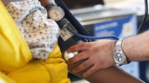 epa10794113 A woman gets her blood pressure checked at a back-to-school event for children and parents at Magic Johnson Park in Los Angeles, California, USA, 10 August 2023. Many schools in the Los Angeles area begin classes on 14 August.  EPA/ALLISON DINNER