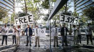 epaselect epa08645714 Supporters of Football Leaks whistleblower Rui Pinto (not pictured) wait outside Justice Campus where his trial is taking place in Lisbon, Portugal, 04 September 2020. Rui Pinto is on trial for 90 crimes, 68 of undue access, 14 of violation of correspondence, six of illegitimate access, and also for computer sabotage to Sporting&#039;s SAD and for extortion of the Doyen investment fund.  EPA/MARIO CRUZ