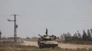 epa11263792 An Israeli soldier on a tank near the border to the Gaza Strip, in southern Israel, 07 April 2024. Israel marks six months since the October 07 attacks, as 134 hostages are currently still being held captive in Gaza, according to the Israeli IDF. More than 33,000 Palestinians and over 1,450 Israelis have been killed, according to the Palestinian Health Ministry and the Israel Defense Forces (IDF), since Hamas militants launched an attack against Israel from the Gaza Strip on 07 October 2023, and the Israeli operations in Gaza and the West Bank which followed it.  EPA/ABIR SULTAN  EPA-EFE/ABIR SULTAN