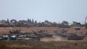 epa11324402 Israeli troops gather at an undisclosed location near the border with the Gaza Strip, in Israel, 07 May 2024. The Israel Defence Forces (IDF) said on 07 May that its ground troops began an operation targeting Hamas militants and infrastructure within specific areas of eastern Rafah, taking operational control of the Gazan side of the Rafah crossing based on intelligence information. More than 34,600 Palestinians and over 1,455 Israelis have been killed, according to the Palestinian Health Ministry and the IDF, since Hamas militants launched an attack against Israel from the Gaza Strip on 07 October 2023, and the Israeli operations in Gaza and the West Bank which followed it.  EPA/ATEF SAFADI