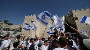 epa11391190 People wave Israeli flags during the controversial &#039;Flag March&#039; at the Damascus Gate in the Old City in Jerusalem, 05 June 2024, as Israel marks its national holiday of Jerusalem Day which commemorates the &#039;reunification&#039; of Jerusalem as Israel took control of the old city of Jerusalem and East Jerusalem following the Six-Day War of 1967.  EPA/ATEF SAFADI