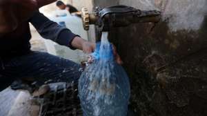 epa11746171 A boy collects water from a donated water pipe on the roadside in Sana'a, Yemen, 28 November 2024. Approximately 9.8 million children in Yemen are in urgent need of safe water, sanitation and hygiene since they are at risk of water borne diseases, including cholera, according to UNICEFâ€™s recent data. Yemenis, especially children, struggle each day to find enough water for cooking and washing as the local water pipe network reaches only 30 percent of the war-torn countryâ€™s 30 million-population who receive water once or twice a month, according to data from local water authorities.  EPA/YAHYA ARHAB