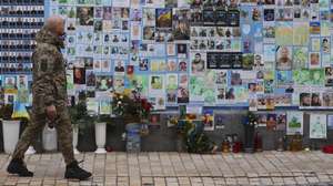 A military walks along one memorial to fallen Ukrainian soldiers near Sofievskaya Square, in Kiev, Ukraine, 04 February 2024. ANTONIO COTRIM/LUSA