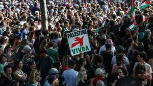epa12166787 A demonstrator holds a placard reading 'Palestine will live' during a solidarity rally for Gaza and Palestine at the Place de la Republique in Paris, France, 09 June 2025. La France Insoumise organizes a protest against Israel’s interception of the Freedom Flotilla and the arrest of 12 humanitarians, including French MEP Rima Hassan and climate activist Greta Thunberg. The FFC stated its Gaza-bound Madleen ship, carrying a small shipment of humanitarian aid, was forcibly intercepted by the Israeli military in international waters on 09 June 2025.  EPA/MOHAMMED BADRA