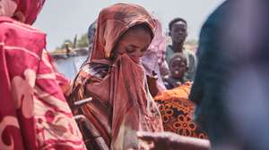 epa11898826 A group of women collect water from the water point set up by Medecins Sans Frontieres, an organisation distributing water tanks for the entire population, in Gerbana, a village 22km from the Sudanese border, South Sudan, 13 February 2025 (issued on 15 February 2025), as  water shortages and diseases resulting from contaminated water have become the community's main complaint. About 110,000 people have arrived in Renk County since December 2024, according to MSF, with 70,000 living in informal settlements such as Gerbana and Atham. There are 975,079 Sudanese refugees in South Sudan, according to UNHCR.  EPA/DIEGO MENJIBAR