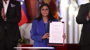 epaselect epa12760438 The acting president of Venezuela, Delcy Rodriguez, holds the document of the approved amnesty law in Caracas, Venezuela, 19 February 2026. Rodriguez asked Parliament, the program that promotes political dialogue, and the commission that seeks to reform the justice system to give 'maximum speed' to the application of the historic amnesty law approved for political prisoners in the South American country.  EPA/Ronald Pena R