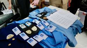 epa12811508 Cambodian authorities display equipment at a building in Phnom Penh, Cambodia, 11 March 2026. Journalists visited the site of an alleged online scam operation at a condominium in Phnom Penh, where Cambodian authorities arrested 65 suspects and seized computers and mobile phones during a crackdown on cyber-fraud networks.  EPA/KITH SEREY