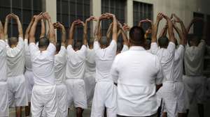 epa10915869 Prisoners stretch their arms at the Terrorism Confinement Center (Cecot) in Tecoluca, El Salvador, 12 October 2023. The Salvadoran mega-prison, inaugurated last February to house 40,000 gang members convicted or detained under an exceptional regime, is operating at 30% of its capacity and has not registered any deaths inside, according to prison authorities.  EPA/Rodrigo Sura