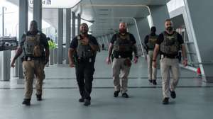 epa12854954 Immigration and Customs Enforcement (ICE) officers walk outside Terminal B of LaGuardia International Airport in New York, New York, USA, 27 March 2026. ICE officers were deployed at major U.S. airports to support security operations during severe TSA staffing shortages.  EPA/OLGA FEDOROVA