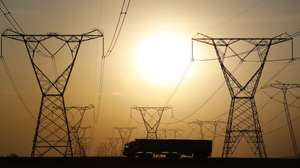 epa07064585 A long haul truck drives under powerlines while traveling on the N3 highway near Johannesburg, South Africa, 02 October 2018. The road is a major highway for trucks hauling goods from the major port city of Durban to the financial hub of the country, Johannesburg. Trucking is a major business in the country as millions of tons of goods has to be ferried from the ports of Durban and Cape Town inland.  EPA/KIM LUDBROOK