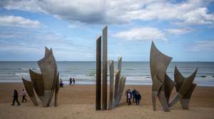 epa13112335 (FILE) - Tourists visit Les Braves monument on Omaha Beach ahead of the 82nd D-Day anniversary in Saint-Laurent-sur-Mer, Normandy, France, 05 June 2026 (reissued on 15 July 2026). France updated the serial nomination for the ‘Beaches of the D-Day Landings, Normandy, 1944’, to be considered for inscription on the World Heritage List, which is now undergoing final evaluation by UNESCO. The proposed inscription covers the full 80 kilometres of the primary landing coastlines defined in 1944: Utah Beach, Omaha Beach, Gold Beach, Juno Beach and Sword Beach.  EPA/CHRISTOPHE PETIT TESSON