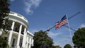 epa12894753 Construction cranes stand and a US flag flutters in the wind at the White House, in Washington, DC, USA, 16 April 2026. US President Donald Trump is traveling to Las Vegas, Nevada, for an event highlighting Republican tax policies after the 15 April tax deadline.  EPA/GRAEME SLOAN / POOL