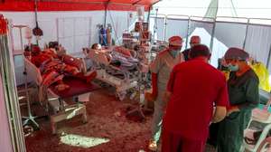 epa13173446 Patients at TC Hillers Hospital receive treatment in a makeshift tent outside the hospital building following a magnitude 7.7 earthquake in Maumere, East Nusa Tenggara province, Indonesia, 16 August 2026. According to the National Search and Rescue Agency of Indonesia (BASARNAS), a magnitude 7.7 earthquake struck off the coast of East Nusa Tenggara province on 15 August 2026, killing at least 51 people.  EPA/MADE NAGI