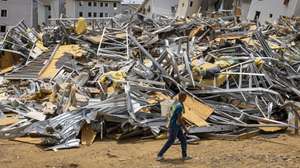 epaselect epa13180936 A man walks past the rubble of homes damaged by earthquakes in Catia La Mar, Venezuela, 17 August 2026 (issued 20 August 2026). Amid the ruins of buildings and the passage of machinery clearing away the rubble, nearly two months after the earthquakes of June 24, daily life has found its way back among hundreds of tents in the Venezuelan state of La Guaira, where precarious conditions and resilience prevail.  EPA/Miguel Gutierrez