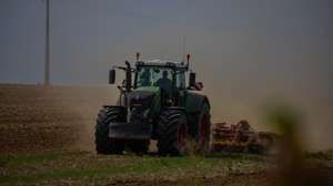 epa12298833 A farmer works with his tractor in a plowed field in Saint Aubin, located 100 km east of Paris, France, 13 August 2025.  EPA/CHRISTOPHE PETIT TESSON