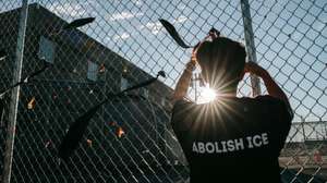 epaselect epa13149169 A protester ties a ribbon on the fence surrounding the Delaney Hall Immigration Detention Facility, in memory of people who died in immigration custody during a vigil for Edwin Jovanny Lopez Cornejo, in Newark, New Jersey, USA, 03 August 2026. At least 54 people have died in ICE custody since the start of the second Trump administration.  EPA/OLGA FEDOROVA