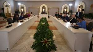 epa13305177 Venezuelan National Assembly President Jorge Rodriguez (C-L), Dinorah Figuera (C-R), head of the opposition negotiating delegation, and other participants take part in the third round of political talks in Caracas, Venezuela, 14 October 2026. The US-backed negotiations between the interim government and a sector of the opposition focus on political and civil guarantees for future elections and judicial reforms.  EPA/RONALD PENA R