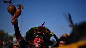epa11440594 An indigenous man participates in a protest against government investments in the agricultural sector in Brasilia, Brazil, 26 June 2024. A hundred indigenous Brazilians protested on 26 June against the government of Luiz Inacio Lula da Silva, over the millions of dollars in aid granted to the booming agricultural sector, with which they are at loggerheads over land tenure. In the Brazilian capital, the indigenous people criticized that the funds destined to the native peoples and to the process of delimitation and regularization of their lands are 'insignificant' in comparison with those received by the landowners.  EPA/Andre Borges