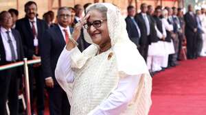 epa11429712 Bangladeshi Prime Minister Sheikh Hasina (front) gestures as she greets people during a ceremonial reception at the Presidential Palace in New Delhi, India, 22 June 2024. The Bangladeshi Prime Minister is on a two-day state visit to India to meet the country's top leadership to discuss economic and political ties between the two countries.This is the first state visit by a foreign leader after the formation of India's new government following the Lok Sabha elections.  EPA/HARISH TYAGI
