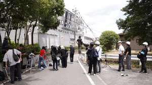 epa13138824 Media members report from the heavily damaged Aeon Mall Kumamoto building in Kashima, Kumamoto Prefecture, southwestern Japan, 29 July 2026. At least 13 people have died and several were injured after a 7.1-magnitude earthquake struck Kumamoto Prefecture, damaging infrastructure including a shopping mall and a factory, according to Japanese Prime Minister Sanae Takaichi.  EPA/RODRIGO REYES MARIN