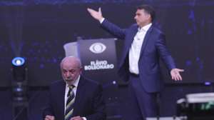 epa13314646 The President of Brazil and candidate for reelection, Luiz Inacio Lula da Silva (L), and opposition candidate Flavio Bolsonaro speak during the first presidential debate at the Rede Bandeirantes headquarters in Sao Paulo, Brazil, 18 October 2026. Lula attacked Bolsonaro by linking him to Argentine President Javier Milei and US President Donald Trump; meanwhile, the opposition candidate responded by connecting his opponent to Nicaraguan Head of State Daniel Ortega and deposed Venezuelan president Nicolas Maduro.  EPA/SEBASTIAO MOREIRA
