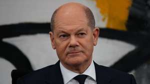 epa10355499 German Chancellor Olaf Scholz looks on during a press conference following a meeting of regional state premiers at the Chancellery in Berlin, Germany, 08 December 2022. The German government and state premiers of the regional German countries meet on a regular basis to decide on political issues.  EPA/CLEMENS BILAN